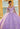 This Valentina Collection dress is available in purple, aqua, and pink.