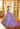 This Valentina Collection dress is available in purple, aqua, and pink.