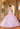 This Valentina Collection dress is available in champagne and purple.