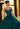 This Valencia Collection dress is available in champagne, green, and blue.