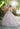 A Morilee Vizcaya Quinceañera Dress. Available in purple, pink, and gold.