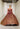 A Morilee Vizcaya Quinceañera Dress. Available in purple, pink, and gold.