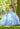This Vizcaya Collection quinceañera dress is available in blue and pink.