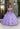 This Vizcaya Collection dress is available in champagne, purple, and red.