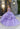 This Vizcaya Collection dress is available in champagne, purple, and red.