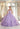 This Vizcaya Collection dress is available in purple, pink, and yellow.