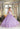 This Vizcaya Collection dress is available in champagne and purple.