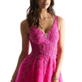 Tulle A-line prom dress with v-neckline and strappy, corset back.