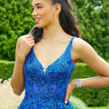 Tulle A-line prom dress with v-neckline and strappy, corset back.