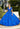 This Valencia Collection quinceañera dress is available in red and blue.