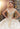 This Vizcaya Collection dress is available in champagne, purple, and red.