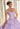 This Vizcaya Collection dress is available in purple, pink, and yellow.