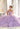 This Vizcaya Collection dress is available in purple, pink, and yellow.