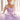 This Vizcaya Collection dress is available in purple, pink, and yellow.