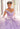 This Vizcaya Collection dress is available in purple, pink, and yellow.