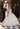 This Vizcaya Collection dress is available in champagne and purple.