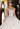 This Vizcaya Collection dress is available in champagne and purple.