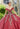 This Vizcaya Collection dress is available in pink, green, and red.