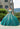 This Vizcaya Collection dress is available in pink, green, and red.